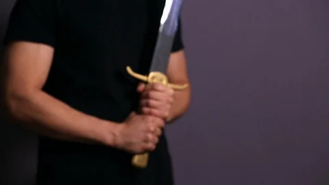 Young Athletic Man Holding His Sword Stock Footage 124291682