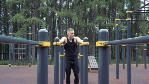 Young athletic man resting after a workout outdoors Stock Footage 114362741