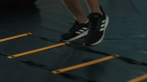 Young athletic man training with coordination ladder. Stock Footage 123011863
