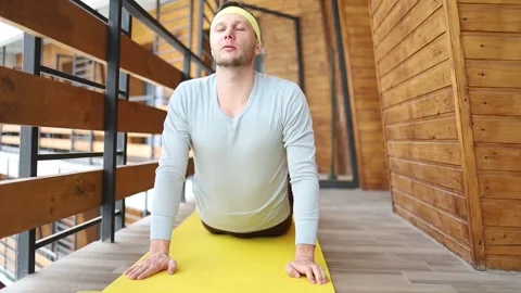 Young athletic man is training at home, doing exercise, working hard Stock Footage 171124280