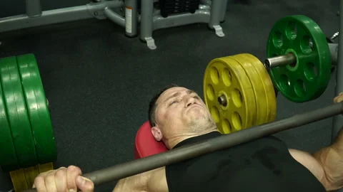 Young athletic man workout with heavy barbell in gym sport muscle training Stock Footage 93503570