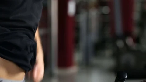 Young athletic men exercising and running on treadmill in sport gym Видео 73890141