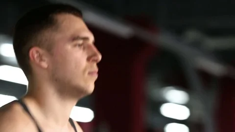 Young athletic men exercising and running on treadmill in sport gym Stock Footage 73890191