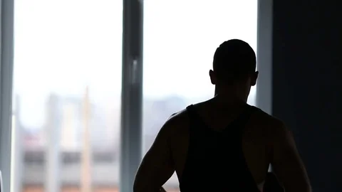 Young athletic men exercising and running on treadmill in sport gym Stock Footage 73890342