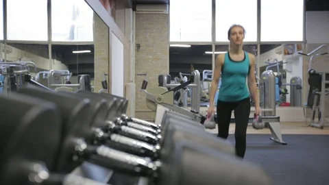 Young athletic woman exercise reverse lunges with kettlebell, camera slider Stock Footage 71607559