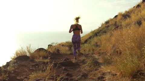 Young Athletic Woman Running on Mountain Trail. Sunset Workout in Nature. Stock Footage 59017711