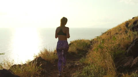 Young Athletic Woman Running on Mountain Trail. Sunset Workout in Nature. Stock Footage 59018319