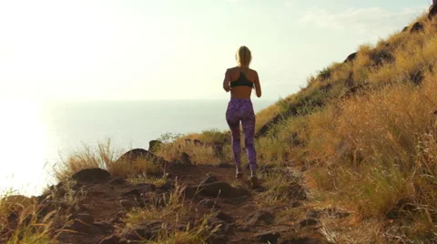 Young Athletic Woman Running on Mountain Trail. Sunset Workout in Nature. Stock Footage 59018940