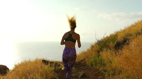 Young Athletic Woman Running on Mountain Trail. Sunset Workout in Nature. Stock Footage 59019226