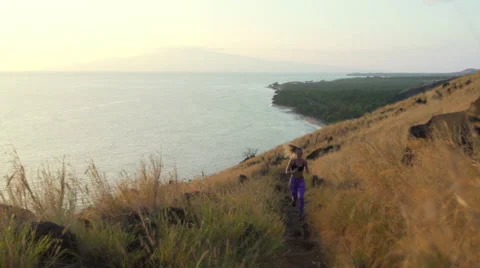 Young Athletic Woman Running on Mountain Trail. POV Follow Cam. Sunset Workou Stock Footage 59042011