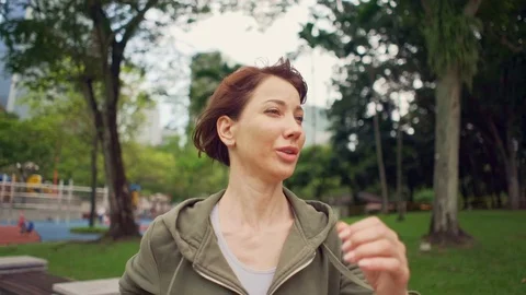 Young attractive and active runner woman  running and jogging on city park Stock Footage 113167009