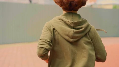 Young attractive and active runner woman hoodie running and jogging in city park Stock Footage 113167043