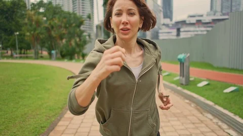 Young attractive and active runner woman running and jogging on city park Stock Footage 113167060