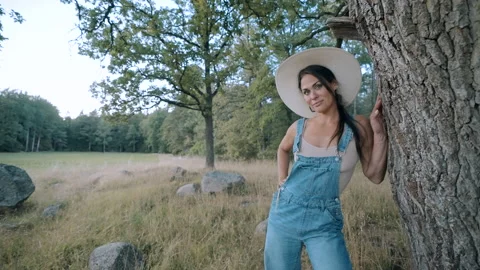 Young attractive beautiful dark haired woman in summer hat Stock Footage 207416148