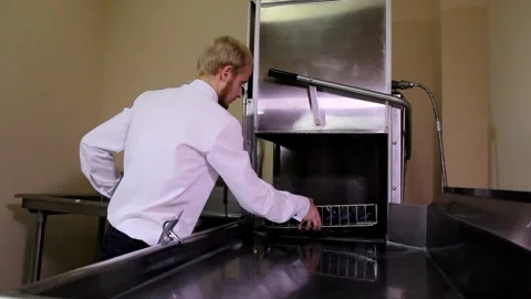 Young attractive blond handsome man cinema movie theater worker cleaning sterile Stock Footage 138959639