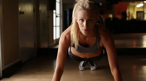 Young Attractive Blond Woman Does Push Ups Stock Footage 55454867