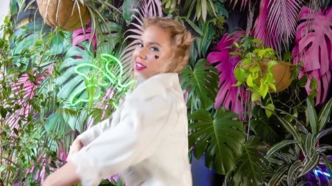 Young attractive blonde posing at the camera on a bright background Stock Footage 189267560