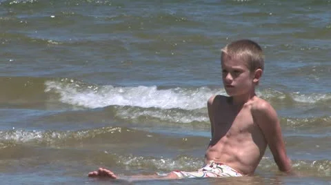 Young attractive boy at the beach - summertime 库存影片 10699000