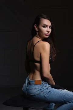 Young attractive brunette posing in studio. Stock Photos