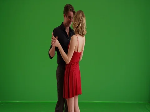 Young attractive couple dancing sensually on green screen Vídeo Stock 79386851