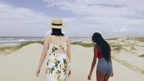 Young attractive couple walking having fun dancing with sand dunes and wide open Video stock 199455974
