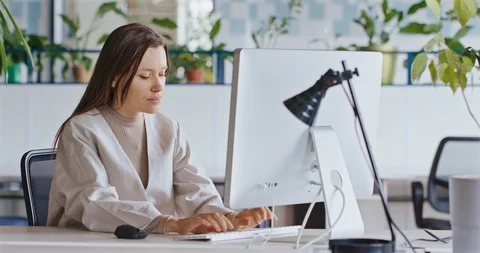 Young Attractive Female Working on a Computer. Video stock 127316501