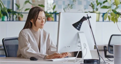 Young Attractive Female Working on a Computer. Stock Footage 127352211