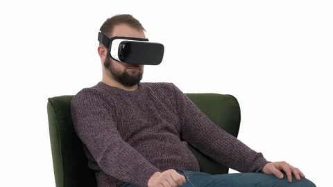 Young attractive guy falling asleep in VR gadget while sitting in comfortable Stock Footage 121197888