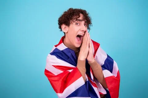 Young attractive guy with a flag posing in the studio. Foto stock