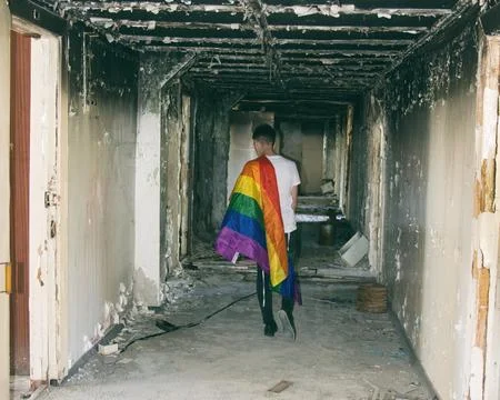 Young attractive guy posing in the studio. Beautiful body. Stock Photos