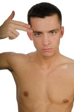 Young attractive guy posing in the studio. Beautiful body. Stock Photos