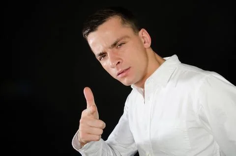 Young attractive guy posing in the studio. Beautiful body. Stock Photos