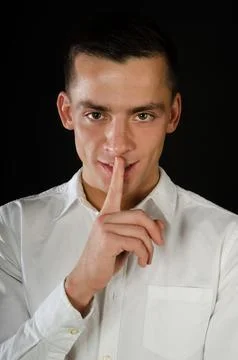 Young attractive guy posing in the studio. Beautiful body. Stock Photos