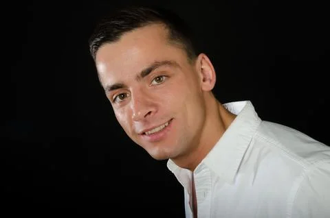 Young attractive guy posing in the studio. Beautiful body. Stock Photos