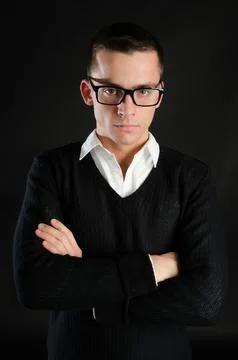 Young attractive guy posing in the studio. Beautiful body. Stock Photos