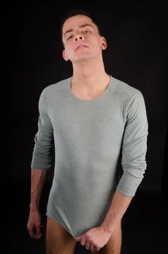 Young attractive guy posing in the studio. Beautiful body. Stock Photos