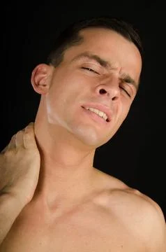 Young attractive guy posing in the studio. Beautiful body. Stock-Fotos