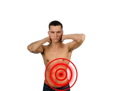 Young attractive guy posing in the studio. Beautiful body. Stock Photos