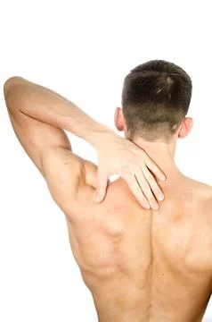 Young attractive guy posing in the studio. Beautiful body. Stock Photos