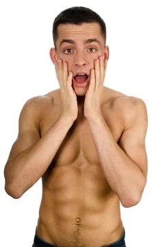 Young attractive guy posing in the studio. Beautiful body. Stock Photos