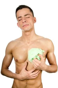 Young attractive guy posing in the studio. Beautiful body. Stock Photos