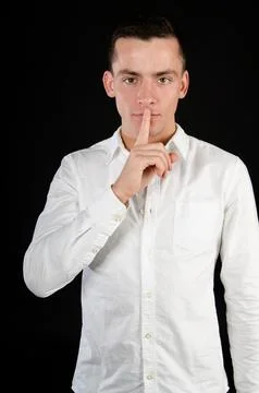Young attractive guy posing in the studio. Beautiful body. Stock Photos