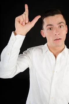 Young attractive guy posing in the studio. Beautiful body. Stock Photos