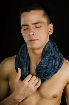 Young attractive guy posing in the studio. Beautiful body. Foto stock