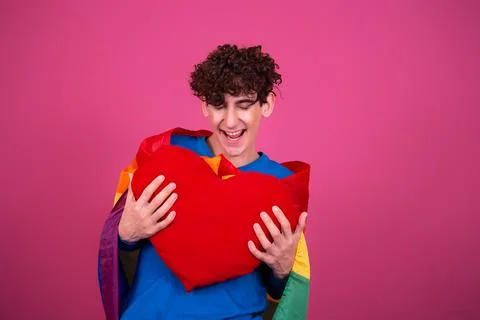 Young attractive guy with a rainbow flag. Stock Photos