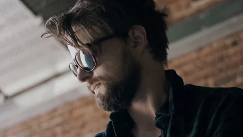 Young Attractive Hipster Watching Down While Assembling His Skateboard Video stock 133638792