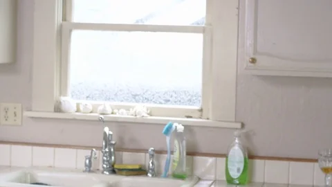 Young attractive hispanic man dances into kitchen and grabs morning cup of tea Stock Footage 84479270