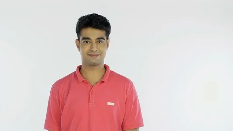 A young attractive man happily clapping hands while looking into the camera Stock Footage 126207492