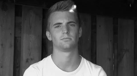 Young attractive man looking at camera Stock Footage 25787771