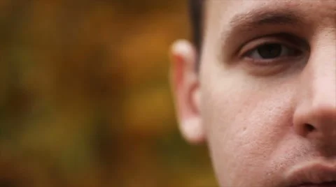 Young attractive man looking at camera Stock Footage 68207320